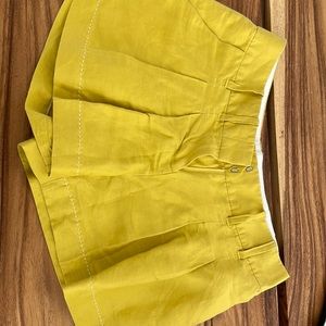 Canary yellow pleated linen shorts, Anthropologie
